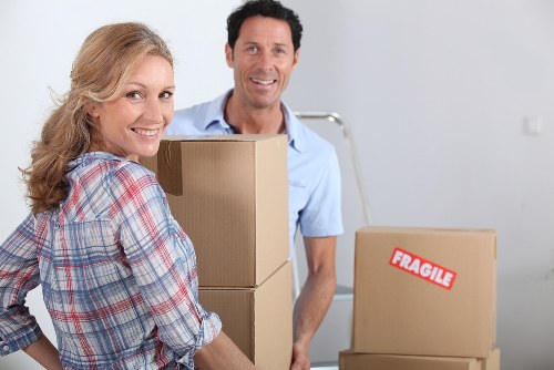 Business relocation boxes and furniture ready for office removals Bayswater